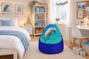 Blue-purple bird beanbag cover in a white Christmas bedroom